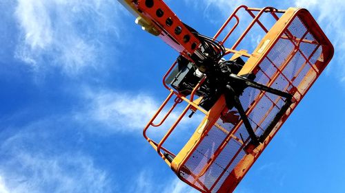 Low angle view of ferris wheel against sky