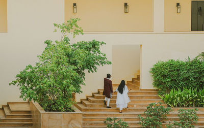 Rear view of woman looking at the wall