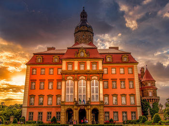 Low angle view of building against sky during sunset