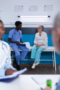 Female doctor examining patient in hospital