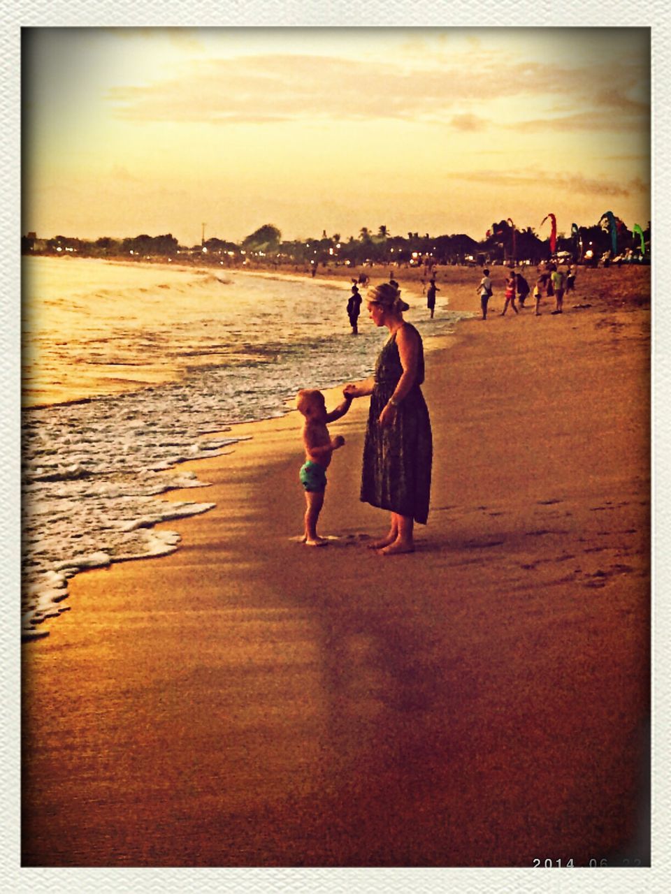 transfer print, auto post production filter, water, lifestyles, leisure activity, sea, sky, men, beach, person, sunset, togetherness, full length, shore, bonding, large group of people, vacations, rear view