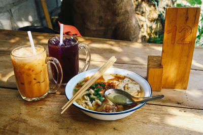 Close-up of tea with drink on table