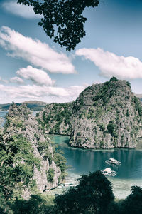 Scenic view of lake and trees against sky