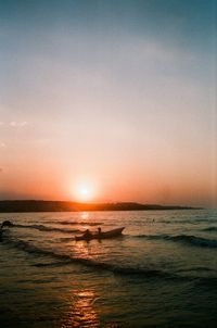 Scenic view of sea against sky at sunset