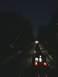 High angle view of train on railroad track at night