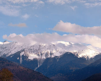 Scenic view of snowcapped mountains against sky