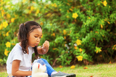 Girl eating food in park