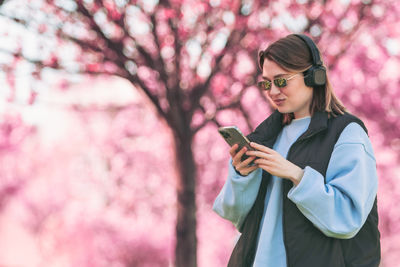 Young woman using mobile phone