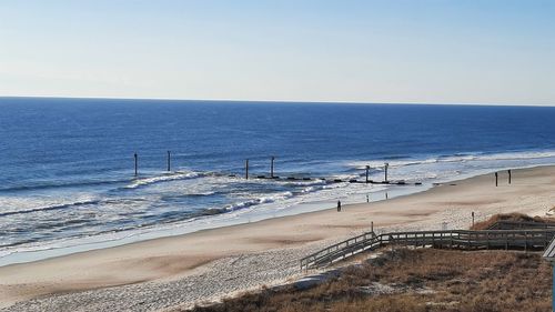 Scenic view of beach against clear sky