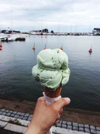 Cropped image of person holding ice cream cone