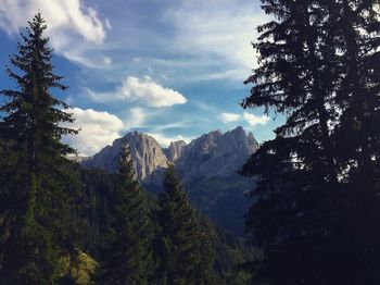 Scenic view of mountains against cloudy sky