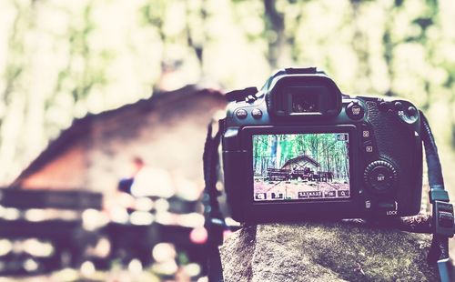 Close-up of digital camera on rock