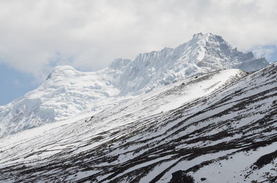 Scenic view of snow covered mountains