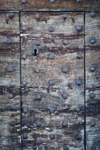 Full frame shot of weathered wooden door