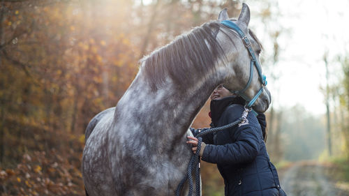 Close-up of woman with horse