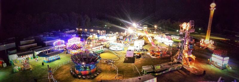 High angle view of illuminated carousel at night