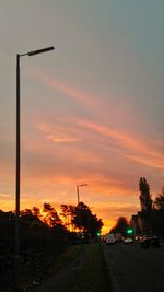 Road against dramatic sky during sunset