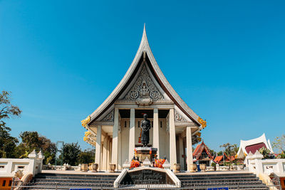 Statue of temple against blue sky