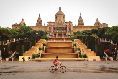 Man riding bicycle on a building