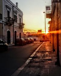 View of city street at sunset