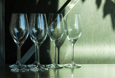 Close-up of wine glasses on table