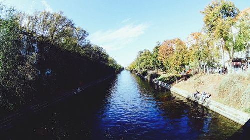 View of canal along trees