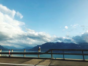 Railing against sea and mountains 