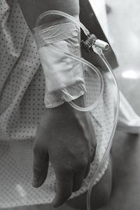 Midsection of woman with iv drip