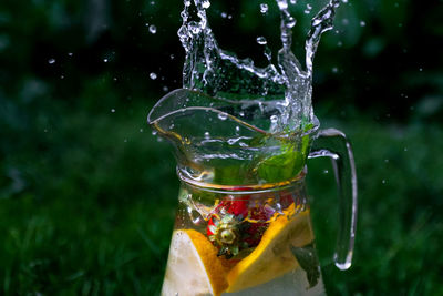 Close-up of water splashing in glass