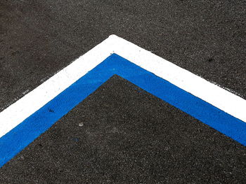 High angle view of arrow sign on road