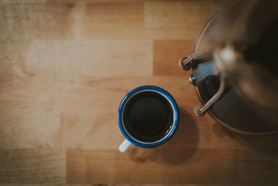 High angle view of coffee cup on table