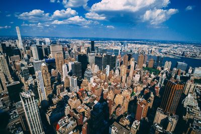 High angle view of modern buildings in city against sky