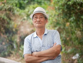 Portrait of smiling man standing outdoors