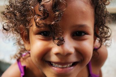 Close-up portrait of smiling cute girl