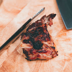 High angle view of meat on barbecue grill