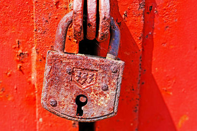 Close-up of padlock on closed gate