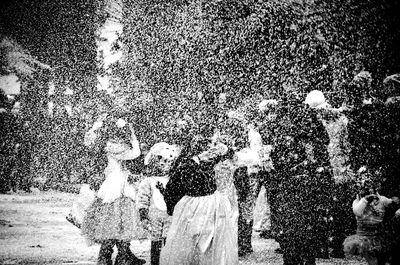 View of people splashing water