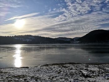 Scenic view of lake against sky during sunset