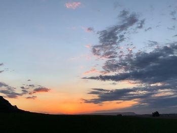 Scenic view of silhouette landscape against sky during sunset