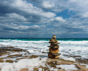 Sea view after a storm with sea foam and clouds