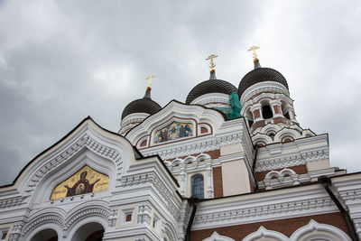 Low angle view of alexander nevsky cathedral against cloudy sky