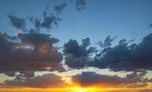 Low angle view of dramatic sky during sunset