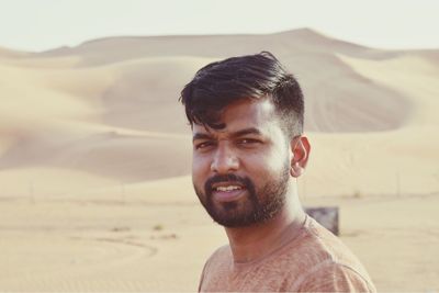 Portrait of smiling man at desert