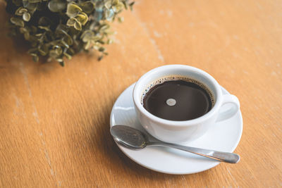 High angle view of coffee cup on table