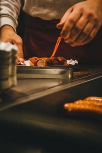 Close-up of man preparing food