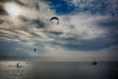 Scenic view of sea against cloudy sky