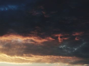 Low angle view of cloudy sky during sunset