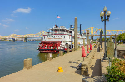 View of bridge over river against buildings