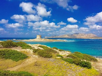 Scenic view of sea against cloudy sky