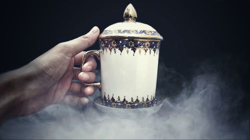 Close-up of hand holding ice cream
